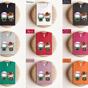 a collection of nine t-shirts, each with a different color and design, arranged in a grid pattern.