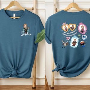 a blue t-shirt with a personalized name and a design of a girl with a heart and a heart-shaped frame.