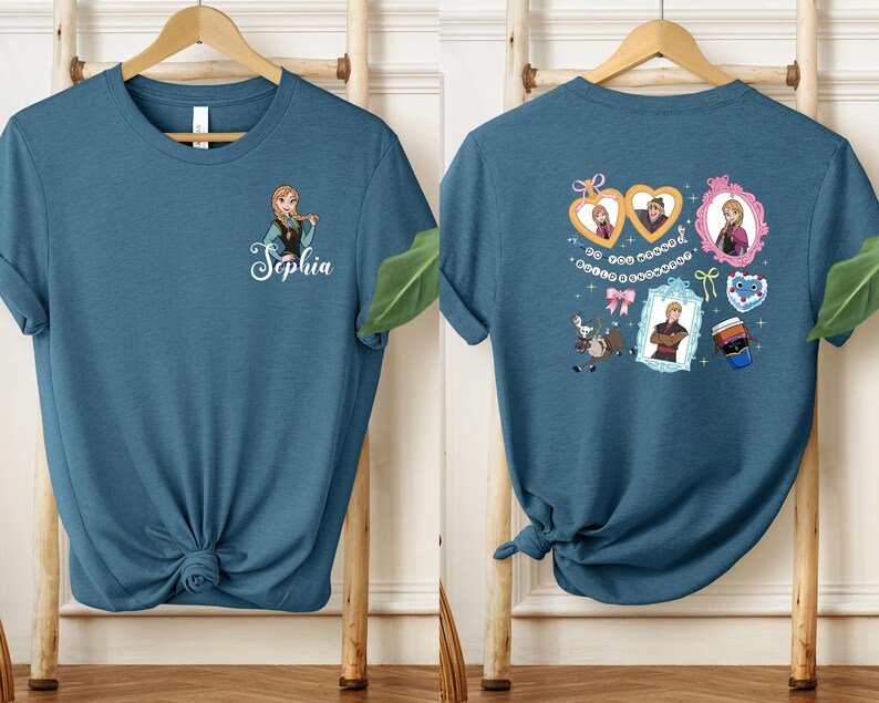 a blue t-shirt with a personalized name and a design of a girl with a heart and a heart-shaped frame.