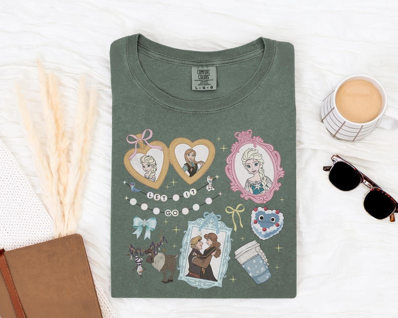a green t-shirt with various cartoon characters and illustrations, including a heart, a cup, a mug, and a pair of sunglasses, all arranged on a white surface.