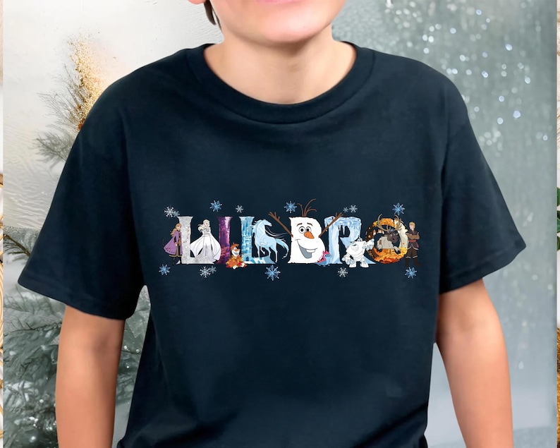 A person wearing a black t-shirt with a graphic design featuring characters from the Disney movie Frozen.