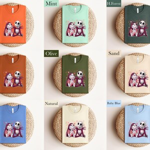 The image is a collage of nine images, each featuring a t-shirt with a different color and design. The t-shirts are arranged in a 3x3 grid, with each row containing three t-shirts. The t-shirts are displayed on a woven mat, and the colors of the t-shirts are orange, mint, green, and forest green. The t-shirts also have a design of two cartoon characters, one of which is a skeleton.