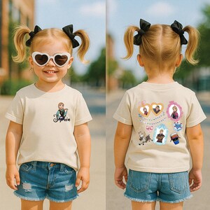 A young girl wearing a white t-shirt with a character from Frozen, sunglasses, and a name tag, standing on a street.