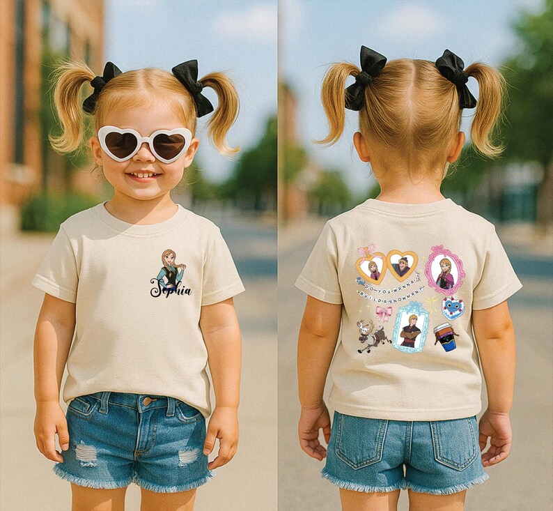 A young girl wearing a white t-shirt with a character from Frozen, sunglasses, and a name tag, standing on a street.