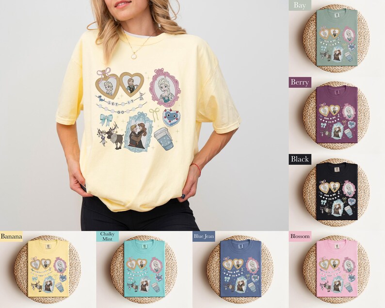 A woman wearing a yellow t-shirt with various illustrations and text, including a heart, a cup, and other decorative elements.