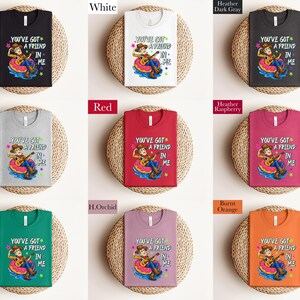 a collection of t-shirts with the same design, arranged in a grid pattern.