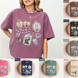 A woman wearing a purple t-shirt with various cartoon-style illustrations and text, including characters and objects such as hearts, cups, and a clock.