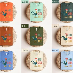 The image is a collage of nine different t-shirt designs, each with a unique color and a cartoon rooster. The designs include orange, mint, green, olive, sand, natural, baby blue, and a blue t-shirt.