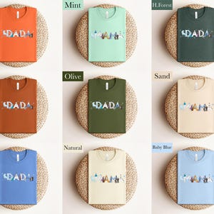 a collection of t-shirts in various colors, including orange, mint, green, olive, sand, blue, natural, and baby blue.