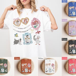 A woman is wearing a white t-shirt with a collage of illustrations and text, including characters from Disney movies and other pop culture references.