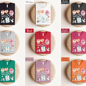 a collection of t-shirts with various colors and designs, arranged in a grid pattern.