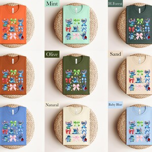 The image is a collage of nine different t-shirt designs, each with a unique color and pattern. The t-shirts are displayed on a woven basket, showcasing the variety of colors and styles available.