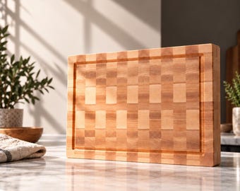 May include: A rectangular wooden cutting board featuring an end-grain construction with a light and medium brown checkered pattern. The board has a recessed juice groove running along the perimeter of the top surface.