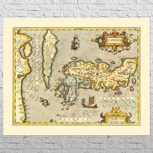 May include: Antique map of Japan, labeled "Japonia", with detailed illustrations of the islands and surrounding waters. The map features a cream-colored background with a decorative border and includes sailing ships and decorative cartouches.