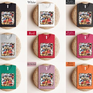 The image is a collage of nine different t-shirt designs, each with a unique color and pattern. The t-shirts are displayed on a woven placemat, showcasing the variety of designs available.