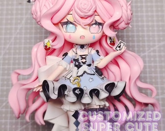 May include: A pink haired doll with a blue and white dress and a black and white checkered bow. The doll is holding a playing card in her hand. The doll is standing on a white surface. The text "CUSTOMIZED SUPER CUTE FIGURES" is written below the doll.
