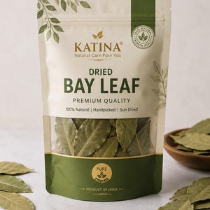 May include: A stand-up pouch of Katina brand dried bay leaves. The packaging is cream-coloured with dark green accents, featuring the text 'DRIED BAY LEAF', 'PREMIUM QUALITY', '100% Natural', 'Handpicked', 'Sun Dried', and 'PRODUCT OF INDIA'.