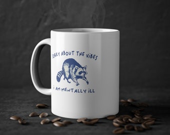 Funny Raccoon Meme White Ceramic Mug - Sorry About the Vibes I Am Mentally Ill, 11oz