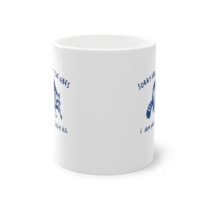 White ceramic mug with funny raccoon meme and caption Sorry About the Vibes, I Am Mentally Ill