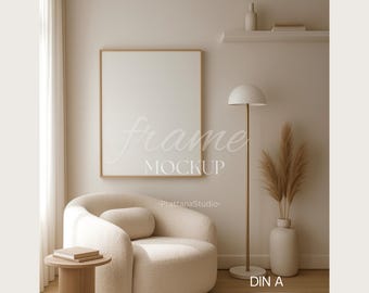 May include: A cozy interior scene featuring a cream-colored, curved armchair with a matching lumbar pillow, a small wooden side table, and a framed mockup. A floor lamp and a vase with dried plants add to the warm, neutral aesthetic. The text "frame MOCKUP" is visible.
