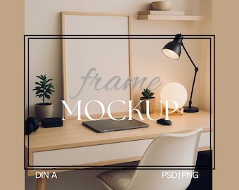 May include: A light wood desk with a framed mockup, laptop, and desk lamp. The desk is styled with a small potted plant, a round lamp, and a white chair. The words "frame MOCKUP" are written on the image.