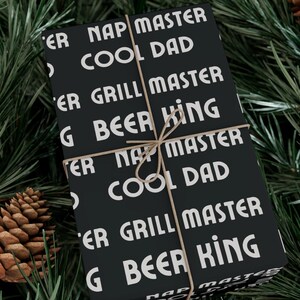 Funny Fathers Day Wrapping Paper, Black Gift Wrap with Cool Dad Slogans, Beer King, Nap Master, Grill Master Gift Wrap for Him
