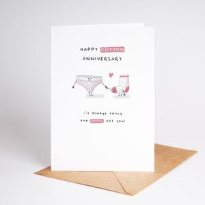 May include: A white card with pink lettering that says "Happy Cotton Anniversary".  The card features a cartoon illustration of a pair of underwear and a sock holding hands.  The text below the illustration says "I'll always fancy the pants off you!"