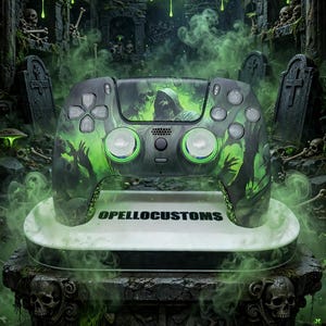 May include: A custom game controller featuring a dark green and black graphic design with a hooded figure, skulls, and the text SOUL REAPER at the top and OPELLOCUSTOMS on the base. The controller has two analog sticks with green rings.