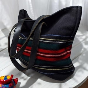 May include: A set of three ceramic mugs with a speckled, matte finish. The mugs are in shades of cream, light gray, and dark gray. Each mug has a simple, minimalist design, perfect for coffee or tea.