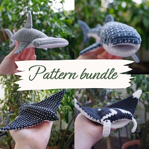 May include: A selection of handmade crochet sea creatures, including a grey hammerhead shark, a blue and white whale shark, and two manta rays. The image includes the text "Pattern bundle" on a banner.