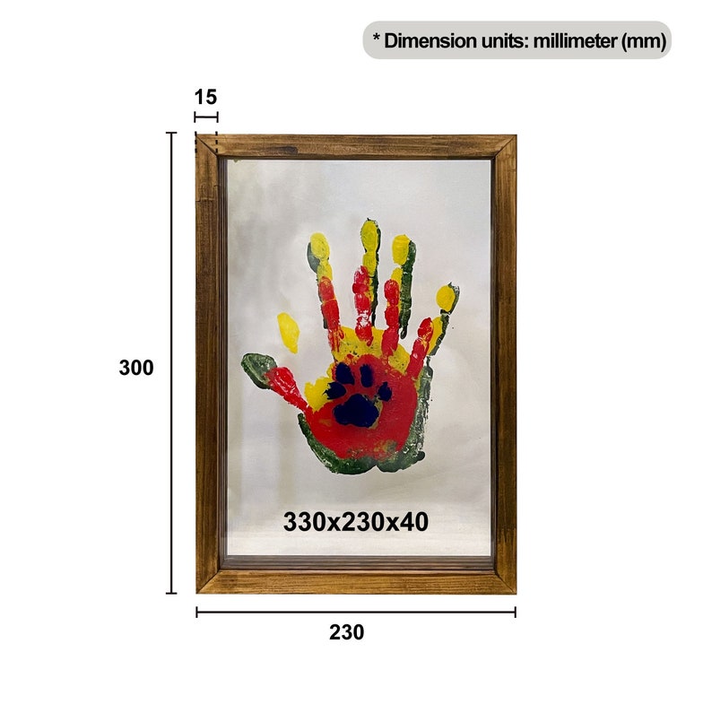 May include: A framed handprint art piece. The wooden frame surrounds a handprint in red, yellow, green, and blue. The frame measures 9.05 x 13 x 0.6 inches, with a depth of 0.6 inches. The handprint is on a white background.