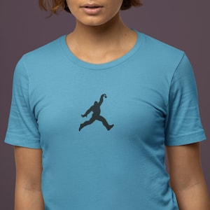 Jump BigFoot | Big-Foot T-Shirt | Funny Big Foot | Sasquatch | Jumpman | Unisex | Women&#39;s Short Sleeve T-Shirt