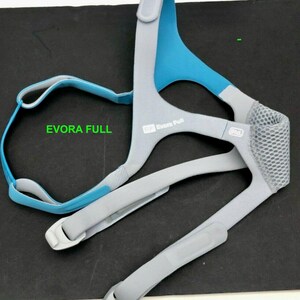 May include: A blue and gray CPAP mask headgear with the text "Evora Full" printed on the strap. The headgear has adjustable straps and a mesh panel.