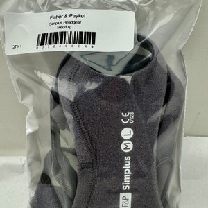 May include: A gray Simplus Headgear, size Med/Lrg, is packaged in a clear plastic bag. The product is labeled "Fisher & Paykel" and includes the text "Simplus Headgear Med/Lrg". The package also has a barcode and the text "QTY 1".