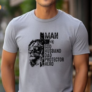 Man of God, Husband, Dad, Protector, Hero Shirt,Religious Gifts,New Dad Shirt,Papa Gift,Dad Birthday Gift,Christian Quotes, Adult Unısex Tee