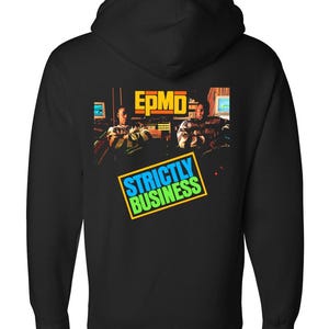 May include: A black zip-up hoodie featuring a graphic print on the back. The print displays the text EPMD in yellow and the text STRICTLY BUSINESS in blue and green within a yellow border, alongside an image of two individuals in a studio.