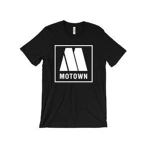 May include: Black t-shirt with a white square logo featuring the Motown Records logo, a stylized "M" with the word "Motown" underneath.