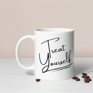 Treat Yourself white ceramic self-care mug with elegant black script. Perfect motivational cup and cozy coffee cup for daily affirmation, anxiety relief mug, mental health gift, self-love mug, empowering mug, wellness drinkware, positive vibes mug, Galentine’s gift, and birthday mug.