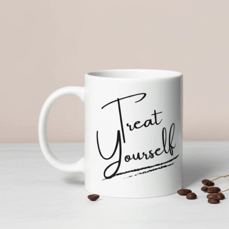 Treat Yourself white ceramic self-care mug with elegant black script. Perfect motivational cup and cozy coffee cup for daily affirmation, anxiety relief mug, mental health gift, self-love mug, empowering mug, wellness drinkware, positive vibes mug, Galentine’s gift, and birthday mug.