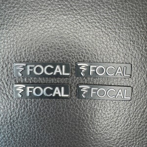 3D aluminum emblem sticker with "Focal" inscription for speakers. Set 4 pieces