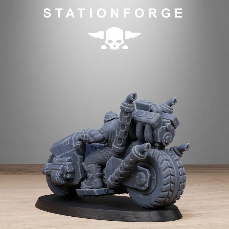 May include: A gray miniature motorcycle with a detailed engine and large tires, mounted on a black base. The text "STATIONFORGE" and a skull logo are visible above the motorcycle.