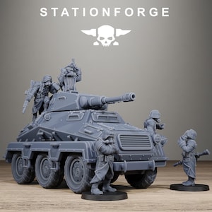 May include: A grey resin model kit featuring an armoured scout vehicle with a turret-mounted cannon, accompanied by four soldier figurines wearing gas masks and long coats. The text STATIONFORGE and a skull logo appear above the vehicle.
