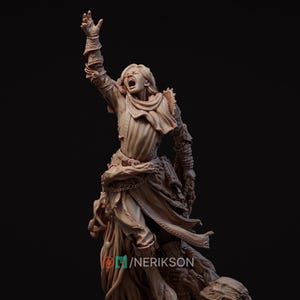 May include: A detailed sculpture of a figure in a dramatic pose, with an arm raised and mouth open in a scream. The figure wears detailed clothing and armour, with a flowing cloak and intricate chain details. The sculpture is a neutral beige colour.