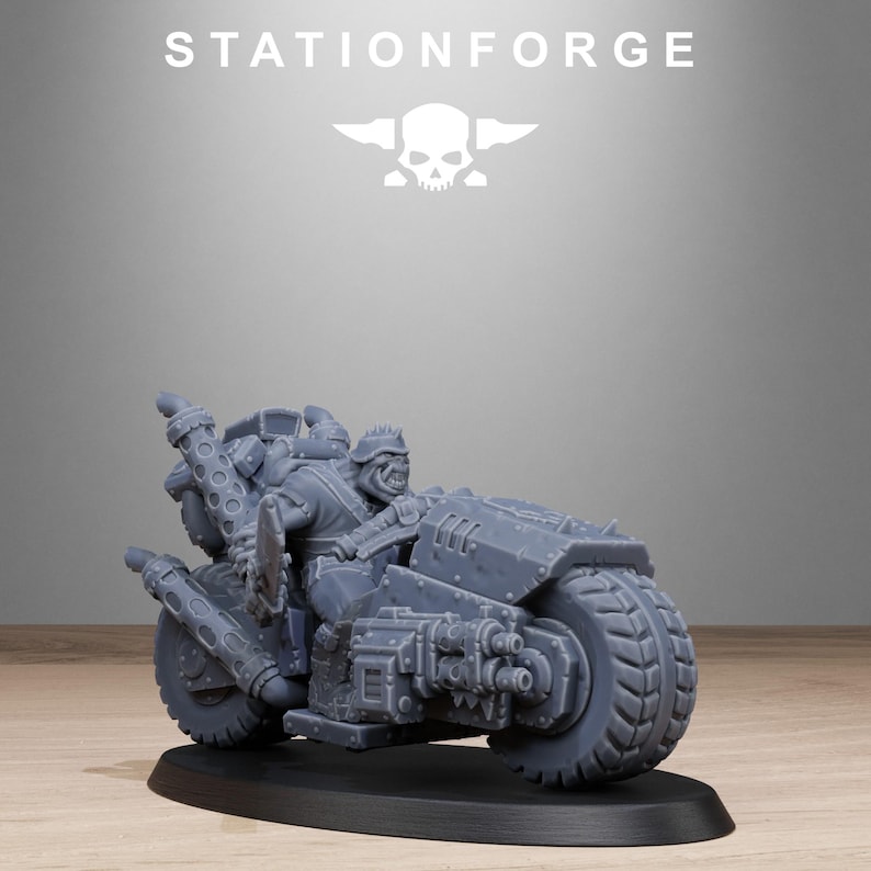 May include: A gray miniature motorcycle with a rider, set on a black base. The motorcycle has large tires, exhaust pipes, and a detailed engine. The rider is wearing armor and a helmet. The text "STATIONFORGE" and a skull logo are in the background.