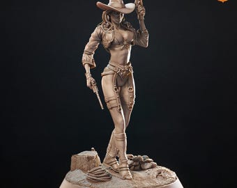 May include: A detailed sculpture of a cowgirl in a hat, holding two pistols. The figure is wearing a vest, shorts, and boots. The sculpture is on a small base with a rope and a tree stump. The color is a light brown.