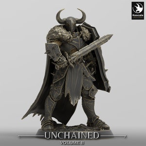May include: A black and gold miniature figure of a warrior wearing a horned helmet, chainmail armor, and a cape. The warrior is holding a sword and shield. The figure is standing on a base with the text "Unchained Volume II".