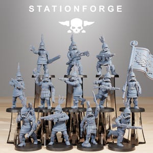 May include: A collection of twelve grey miniature soldier figurines, each wearing a helmet with a crest and a gas mask. The figures are posed in various stances, some holding rifles or swords, and one carries a large flag. The text STATIONFORGE and a skull logo appear above the figures.