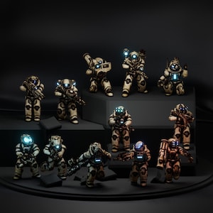 May include: A group of 12 beige and white robot figurines with blue glowing eyes. The robots are holding various weapons and are posed in different action stances. The figurines are arranged on a black surface with a black background.