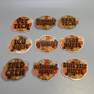 May include: Nine colorful, retro-style pins with various job titles. Titles include "VET TECH," "VETERINARY TECHNICIAN," "XRAY TECH," "ICU NURSE," "OPTOMETRY," "PEDS NURSE," "SPED CREW," "OCCUPATIONAL THERAPY," and "DIALYSIS NURSE." Each pin features a floral design.