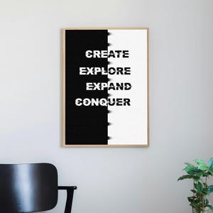 May include: Black and white print with the words "CREATE", "EXPLORE", "EXPAND", and "CONQUER" in a bold, sans-serif font.